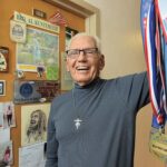 Borther Al Kuntemeier with his many winning tennis medals.